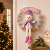 Cute Christmas Wreath Door Hanger with Plush Holiday Character and Pink Festive Banner
